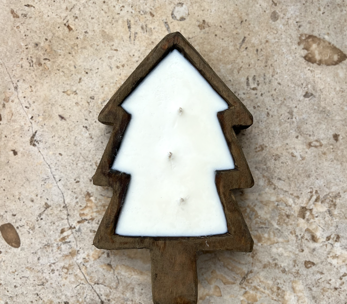 Christmas tree shaped candle with wooden base