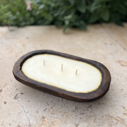 Cinnamon candle in wooden bowl with three wicks