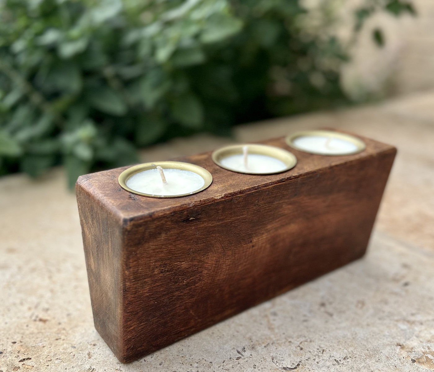 Wooden candle holder with three candles