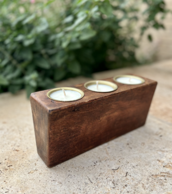 Wooden candle holder with three candles